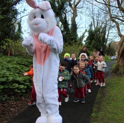 A picture of the Easter Bunny hopping through Castle Park Forest