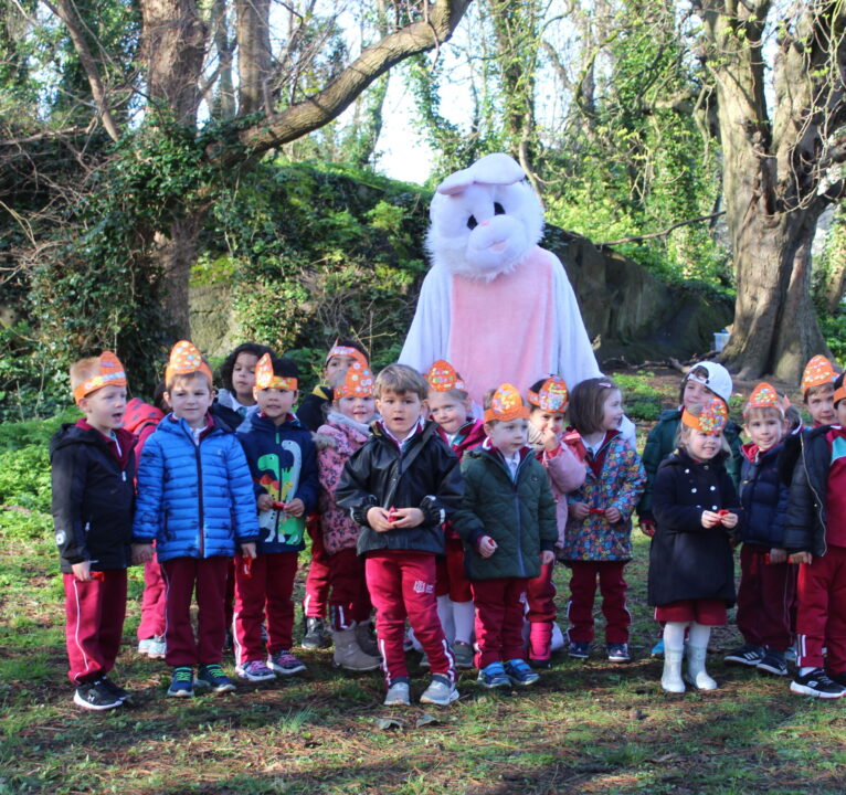 A photo of children from the Early Years Department with the Easter Bunny
