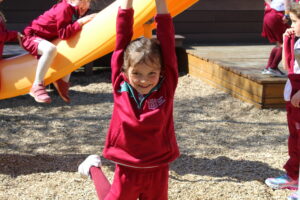 An image of a Prep Pupil playing in the adventure playground