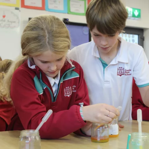 Two Castle Park Pupils working on a Science Experiment