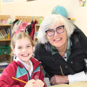 A pupil from our Prep Department smiling for a photo with her Granny
