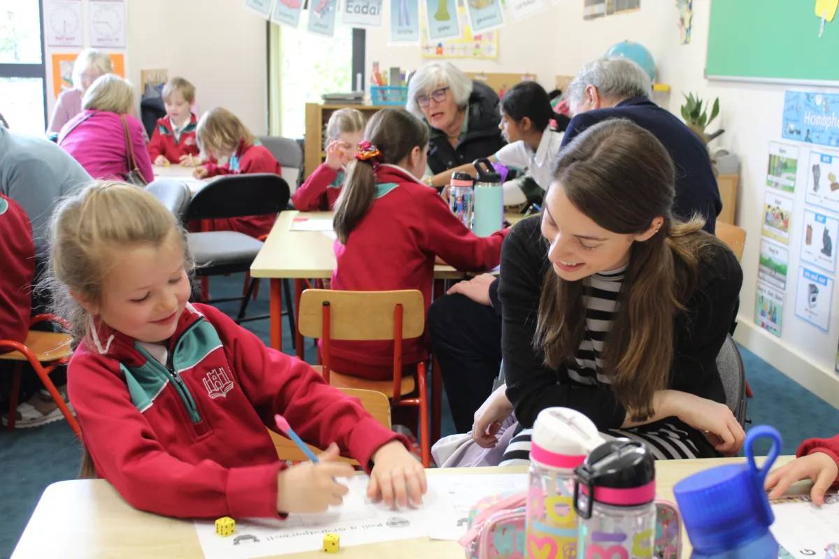 A pupil from our Prep Department smiling with her Special Visitor